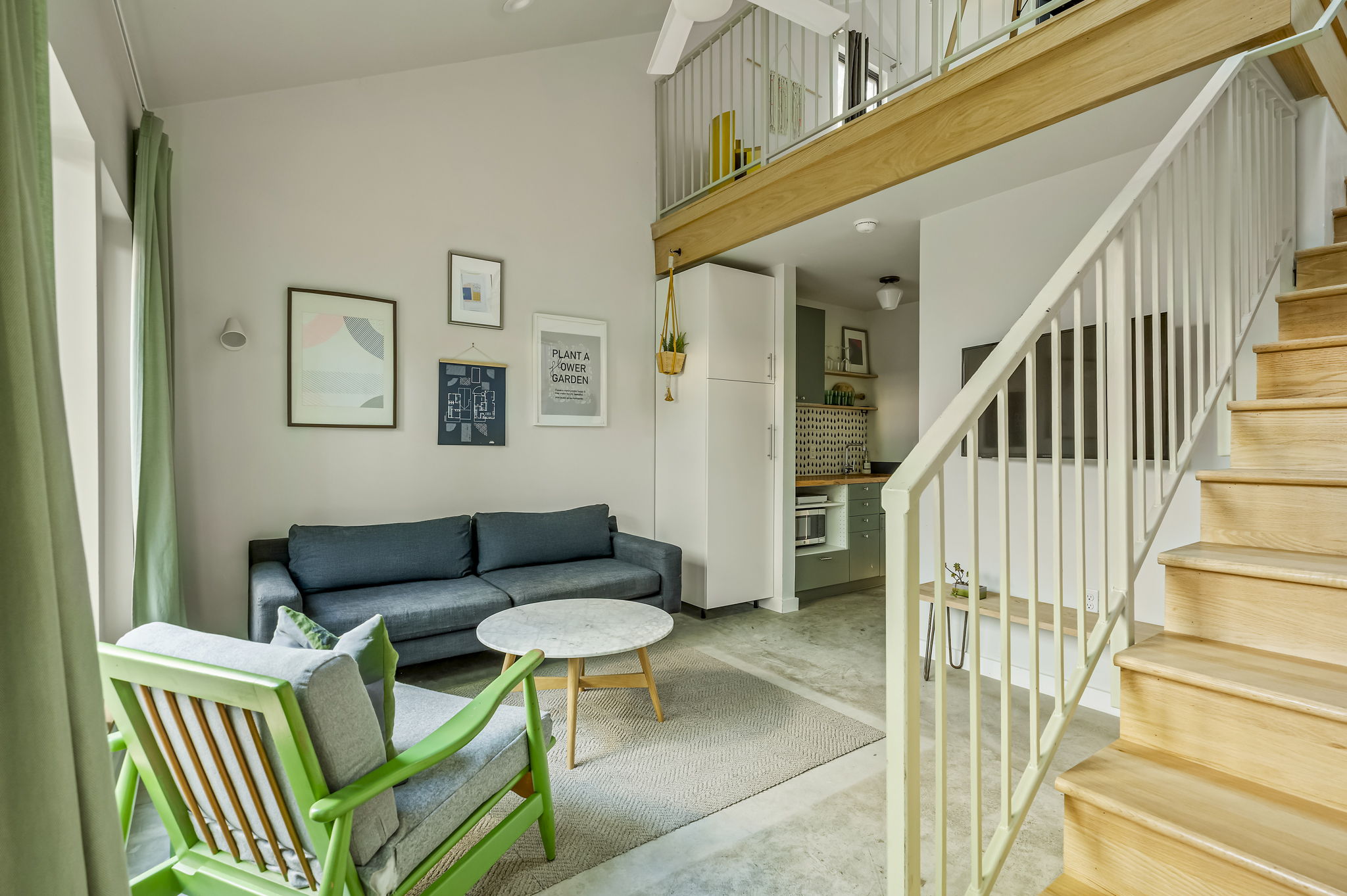 618 Denson Drive Austin, TX 78752 - Photo 29 of 35 a living room with furniture and a wooden floor