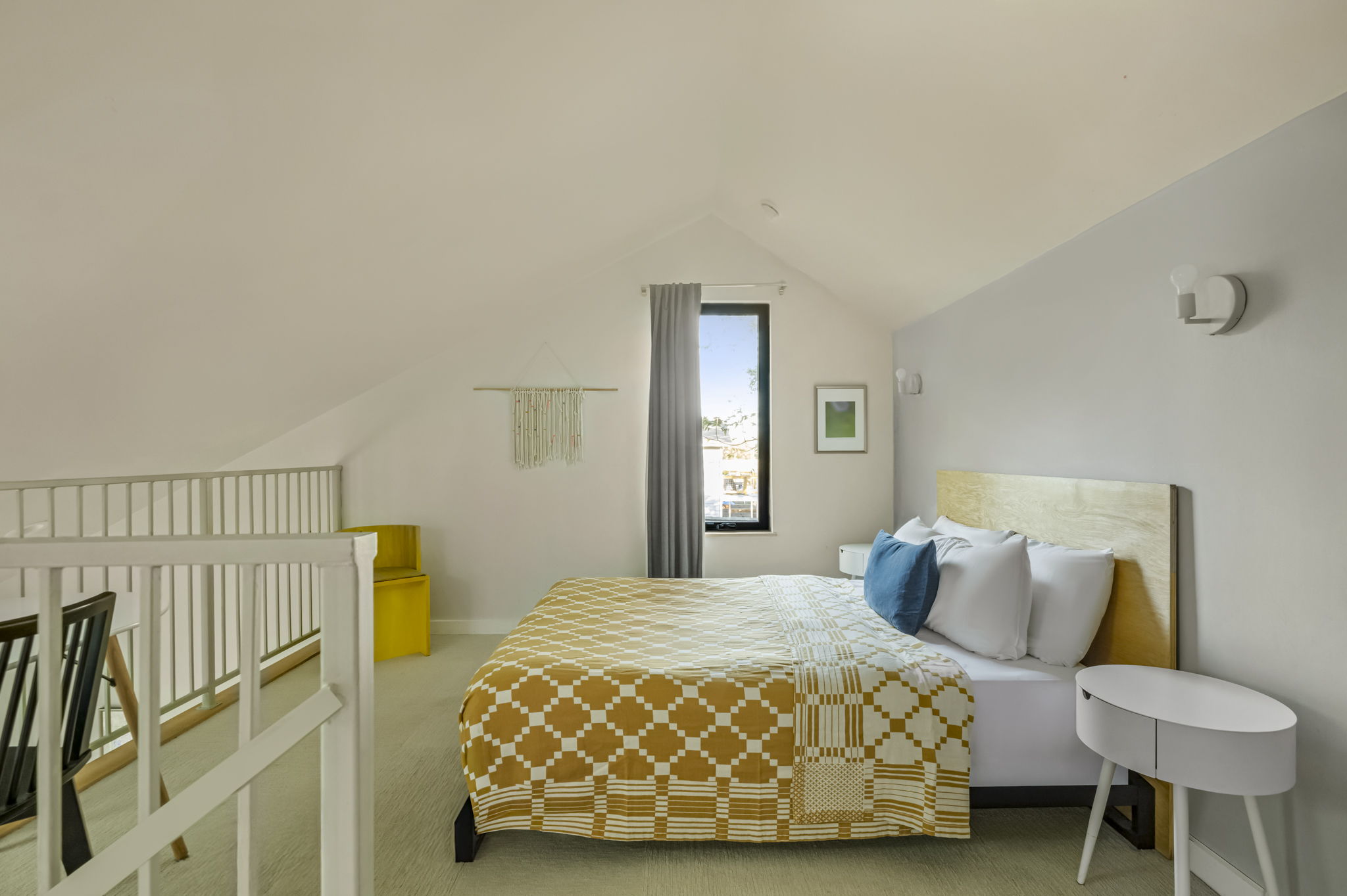 618 Denson Drive Austin, TX 78752 - Photo 30 of 35 a bedroom with a bed and a chair