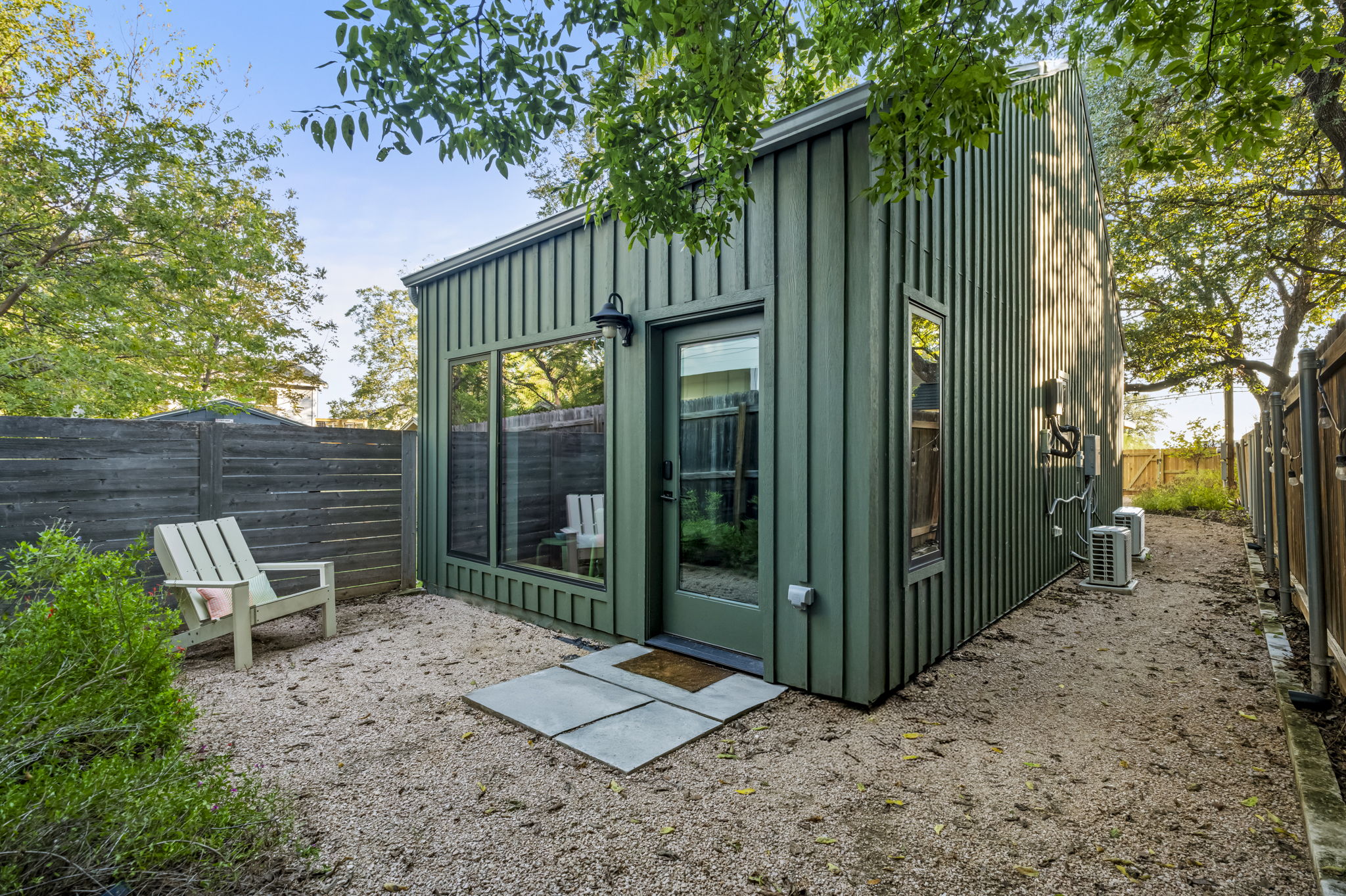 618 Denson Drive Austin, TX 78752 - Photo 32 of 35 a backyard of a house with chairs and table