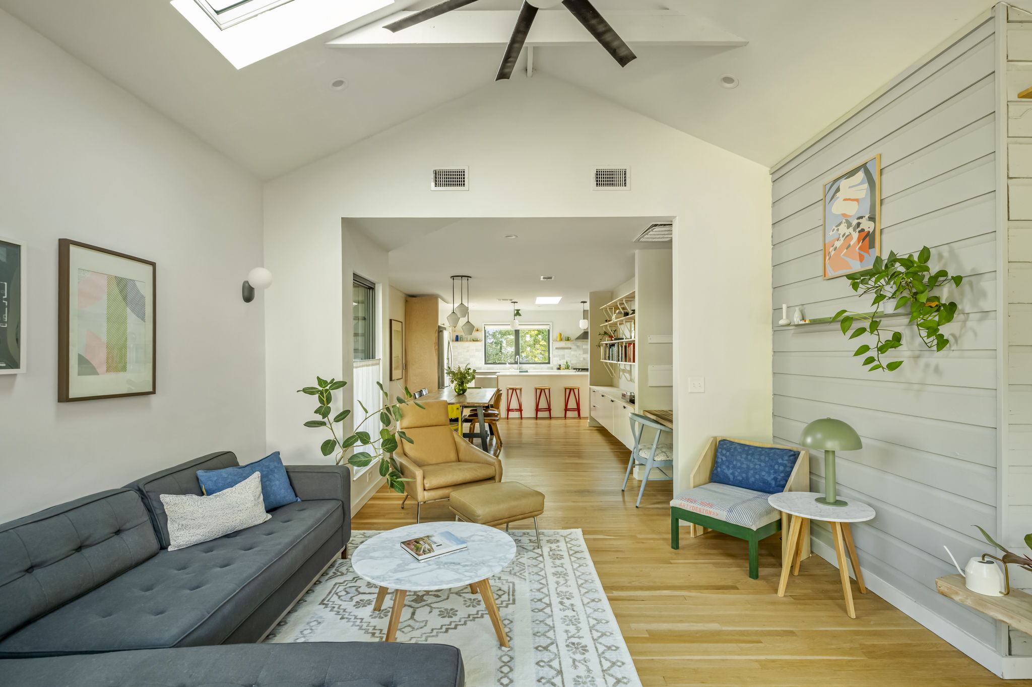 618 Denson Drive Austin, TX 78752 - Photo 6 of 35 a living room with furniture and a chandelier