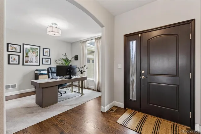 a living room with furniture and a rug