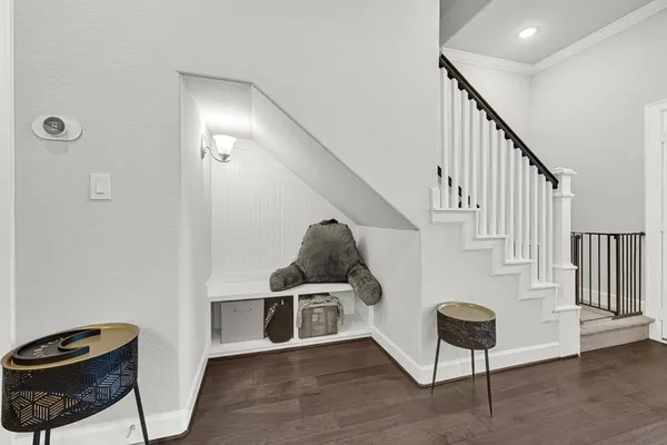 a view of entryway and hall with wooden floor