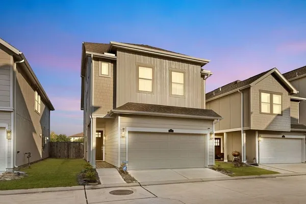 a front view of a house with a garage