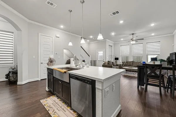 an open kitchen with a table and chairs