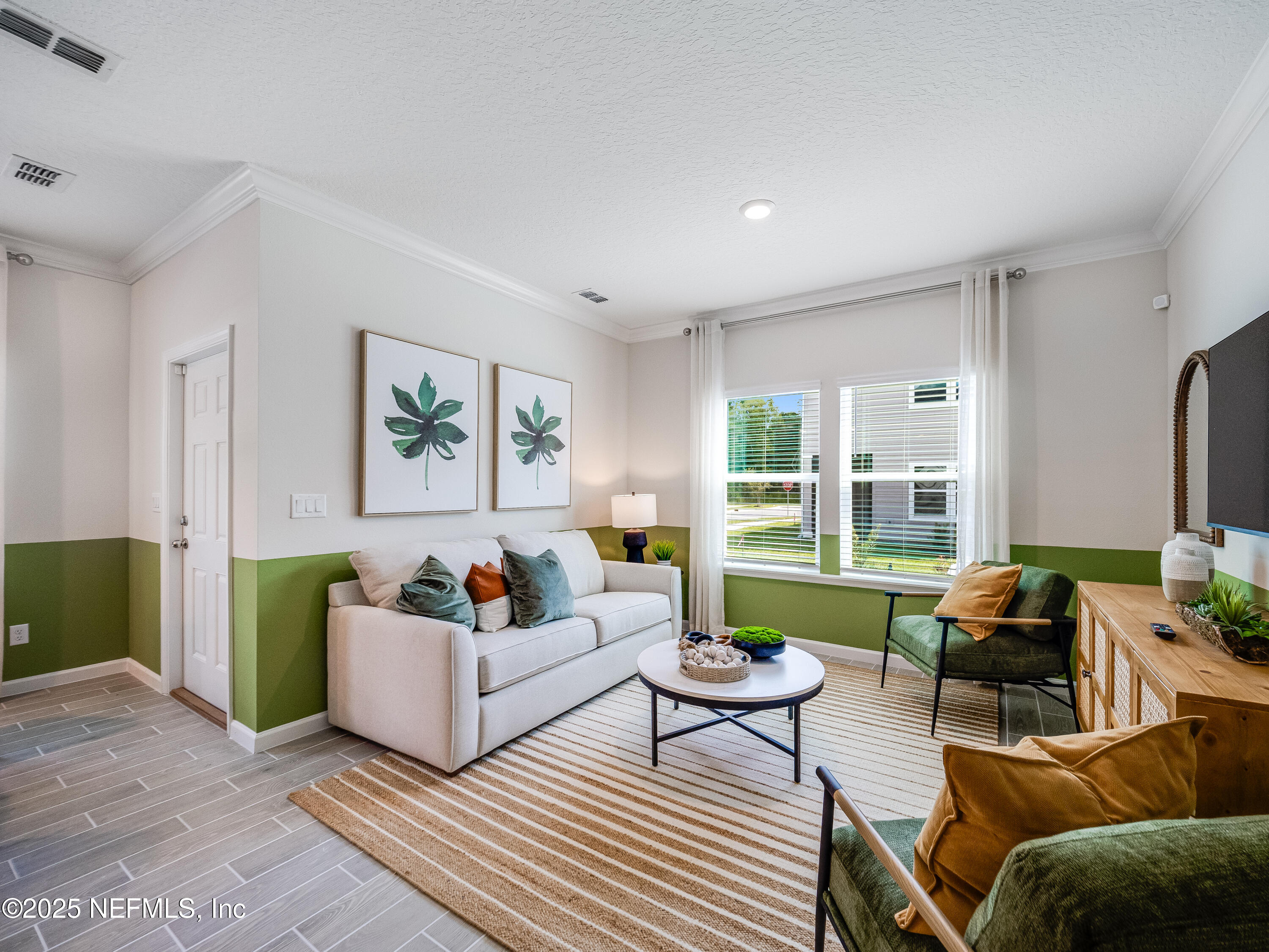 101 Hubbard Bend St. Augustine, FL 32092 - Photo 23 of 42 a living room with furniture and a large window