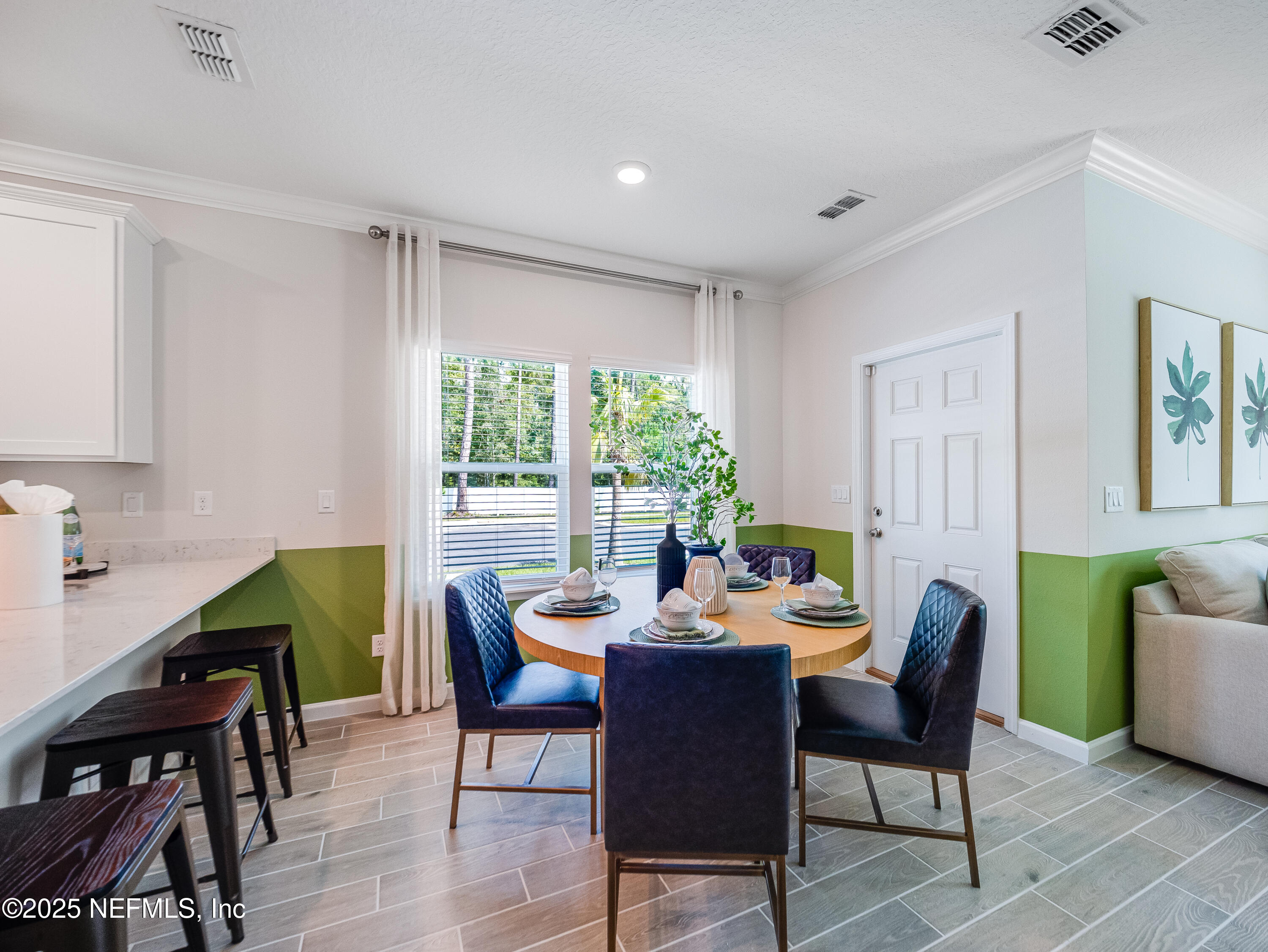 101 Hubbard Bend St. Augustine, FL 32092 - Photo 38 of 42 a dining room with furniture a window and a kitchen view