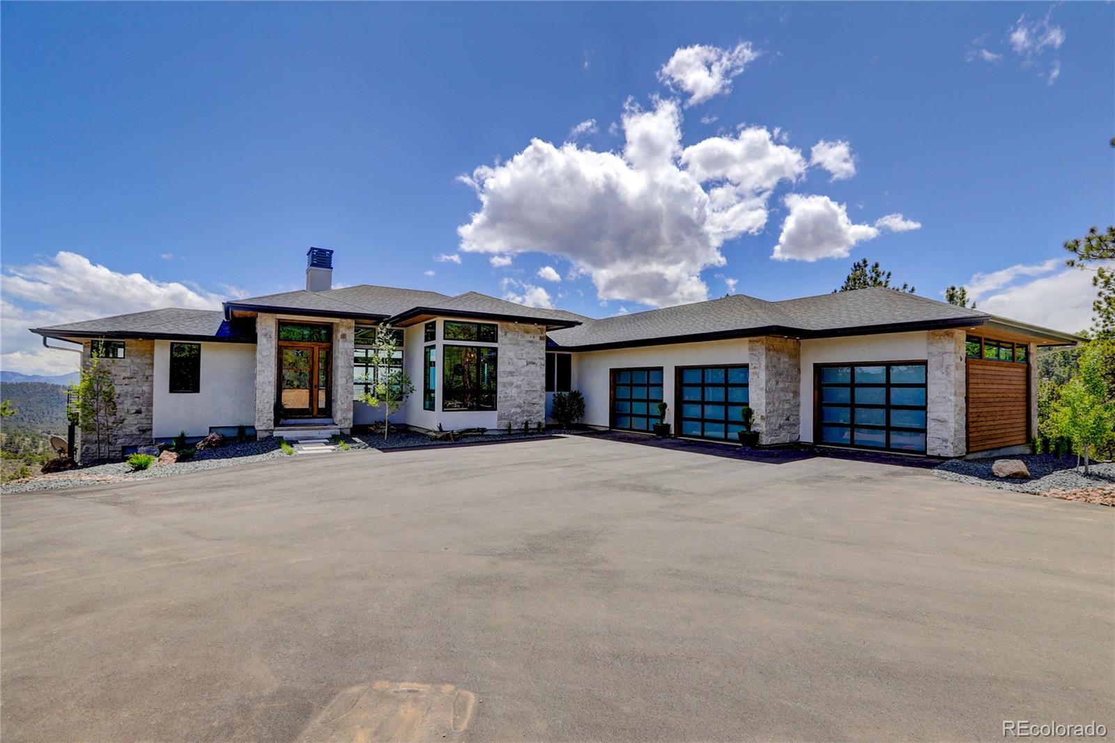 a view of a house with a yard and seating space