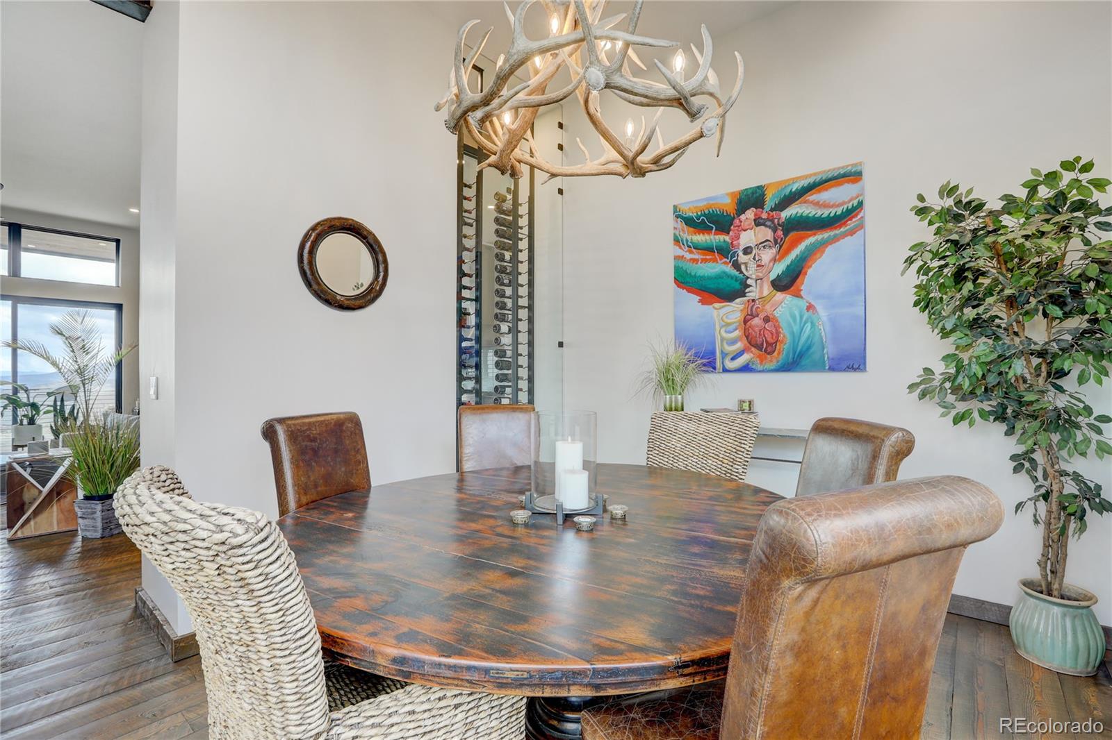 31995 Half Peak Trail Pine, CO 80470 - Photo 11 of 40 a view of a dining room with furniture and wooden floor