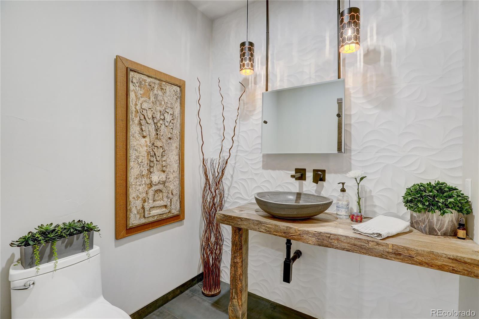 31995 Half Peak Trail Pine, CO 80470 - Photo 12 of 40 a bathroom with a sink and a mirror