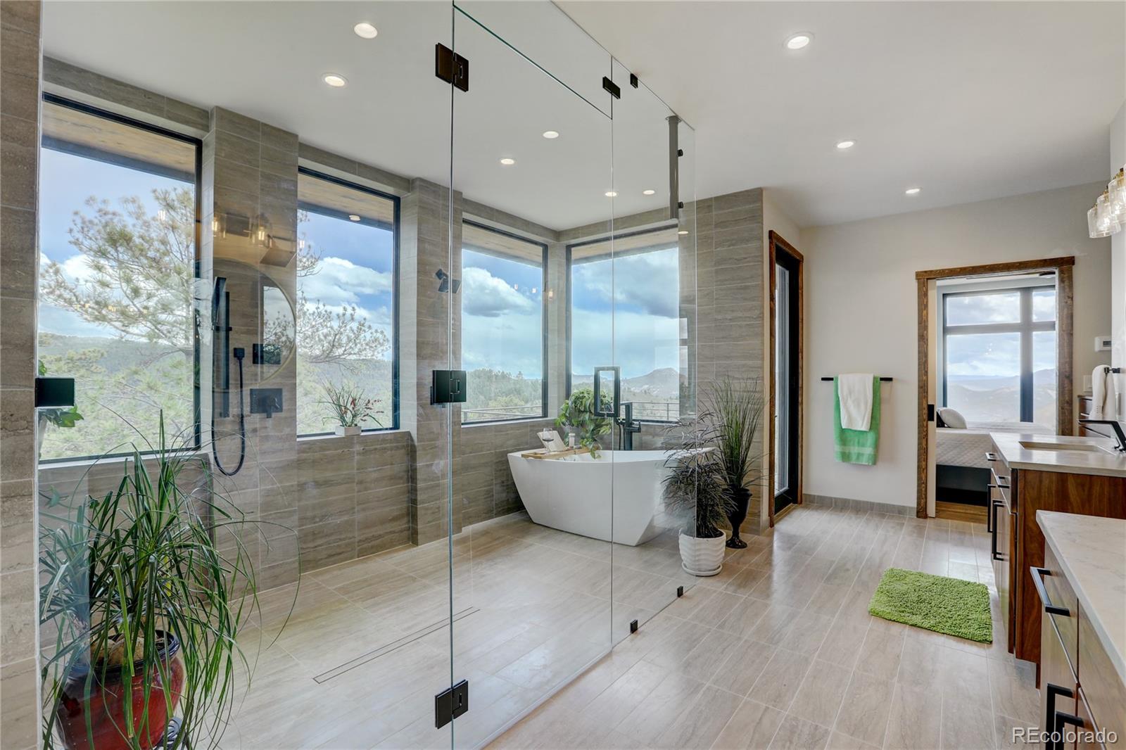 31995 Half Peak Trail Pine, CO 80470 - Photo 17 of 40 a living room with furniture and a large window