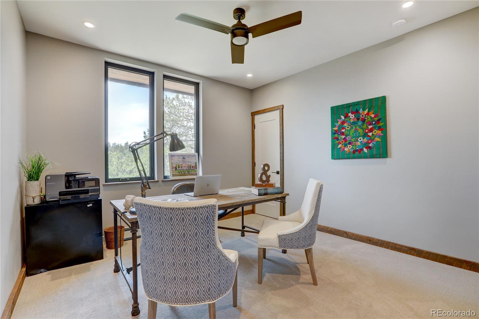 31995 Half Peak Trail Pine, CO 80470 - Photo 21 of 40 a dining room with furniture and window