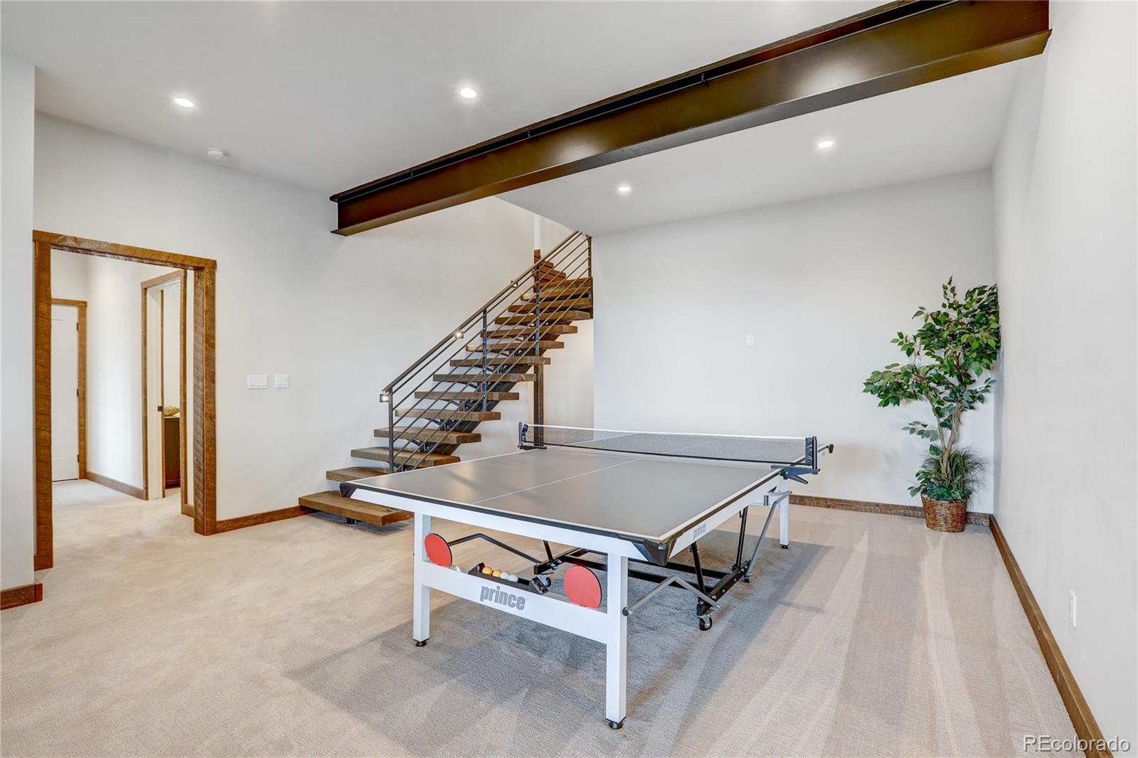 31995 Half Peak Trail Pine, CO 80470 - Photo 24 of 40 a room with table and potted plants