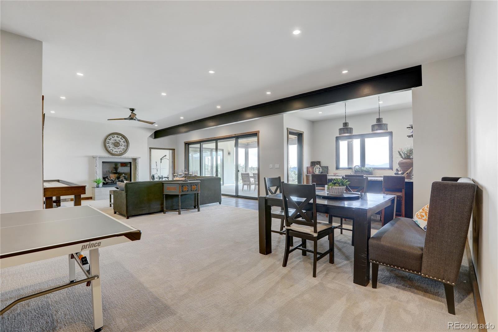 31995 Half Peak Trail Pine, CO 80470 - Photo 25 of 40 a living room with furniture and a large window