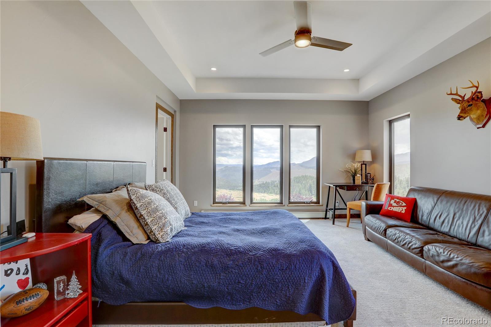 31995 Half Peak Trail Pine, CO 80470 - Photo 29 of 40 a bedroom with a bed and a couch