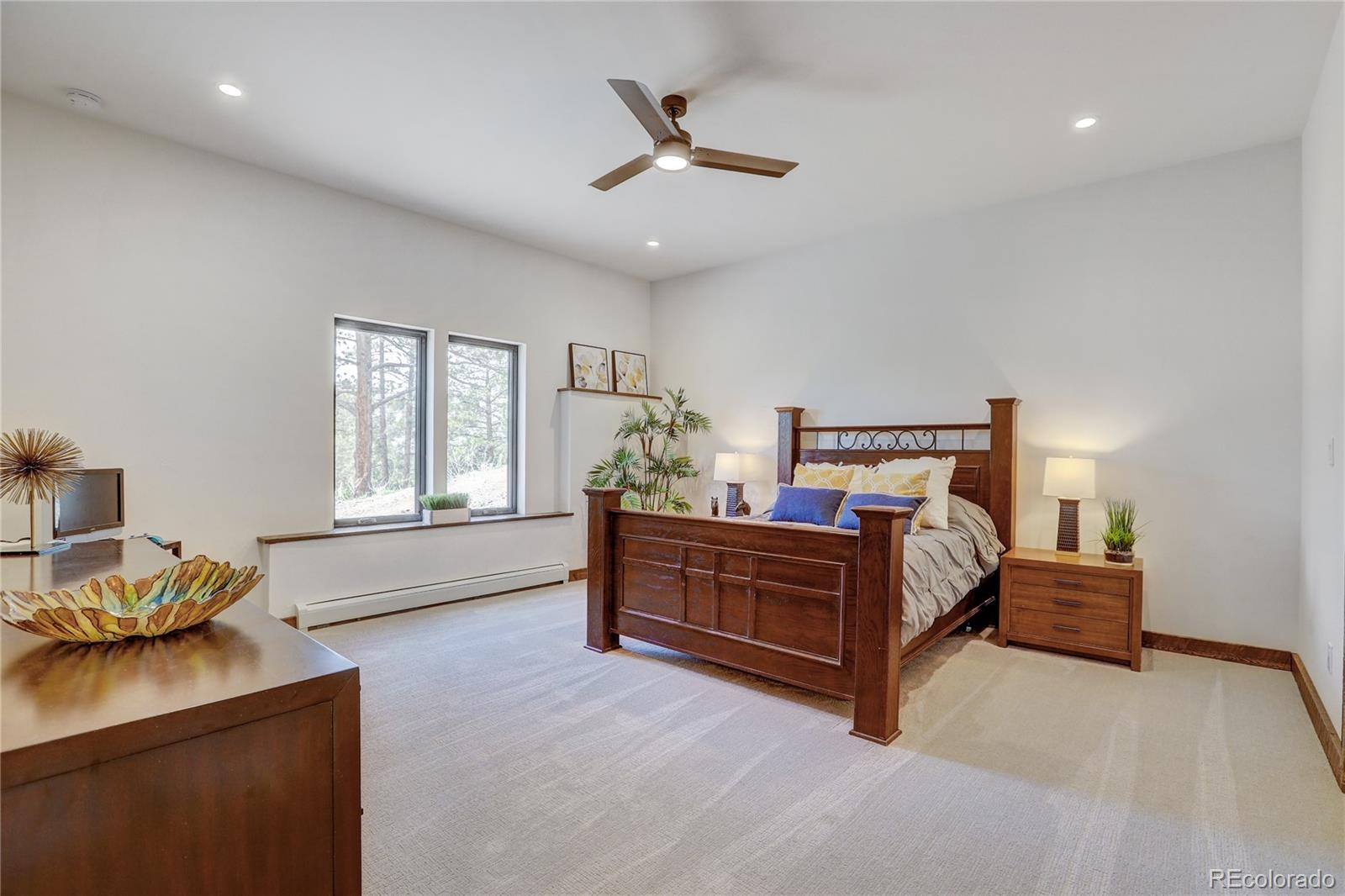 31995 Half Peak Trail Pine, CO 80470 - Photo 30 of 40 a bed room with a bed and a window