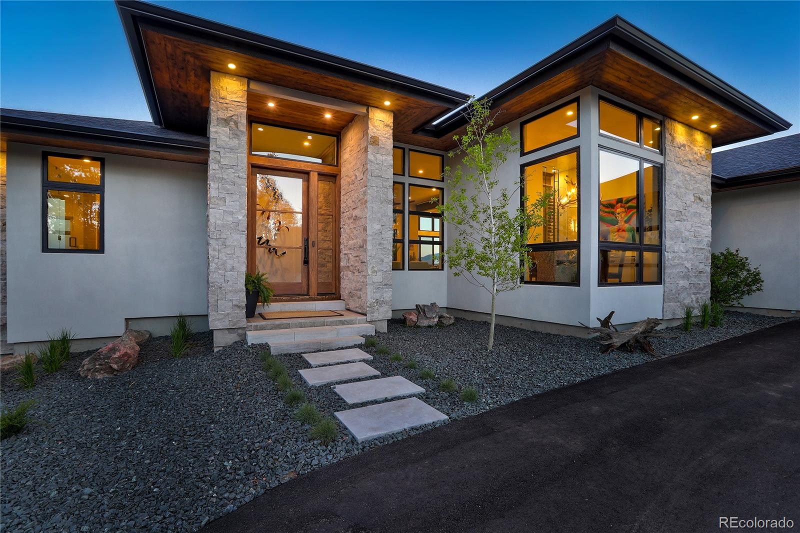 31995 Half Peak Trail Pine, CO 80470 - Photo 35 of 40 a view of a house with backyard and porch