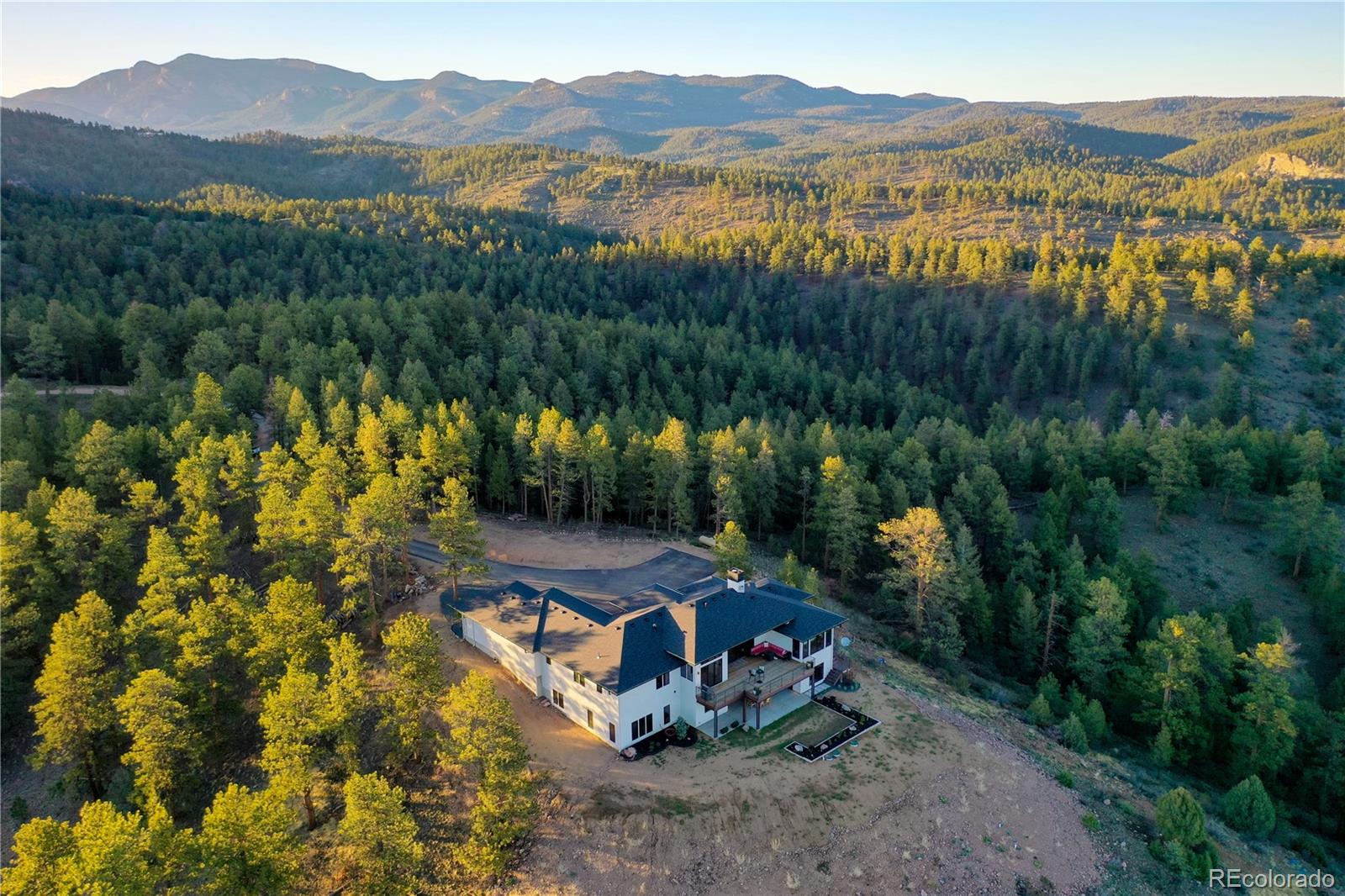 31995 Half Peak Trail Pine, CO 80470 - Photo 37 of 40 a view of a lake with a mountain in the background