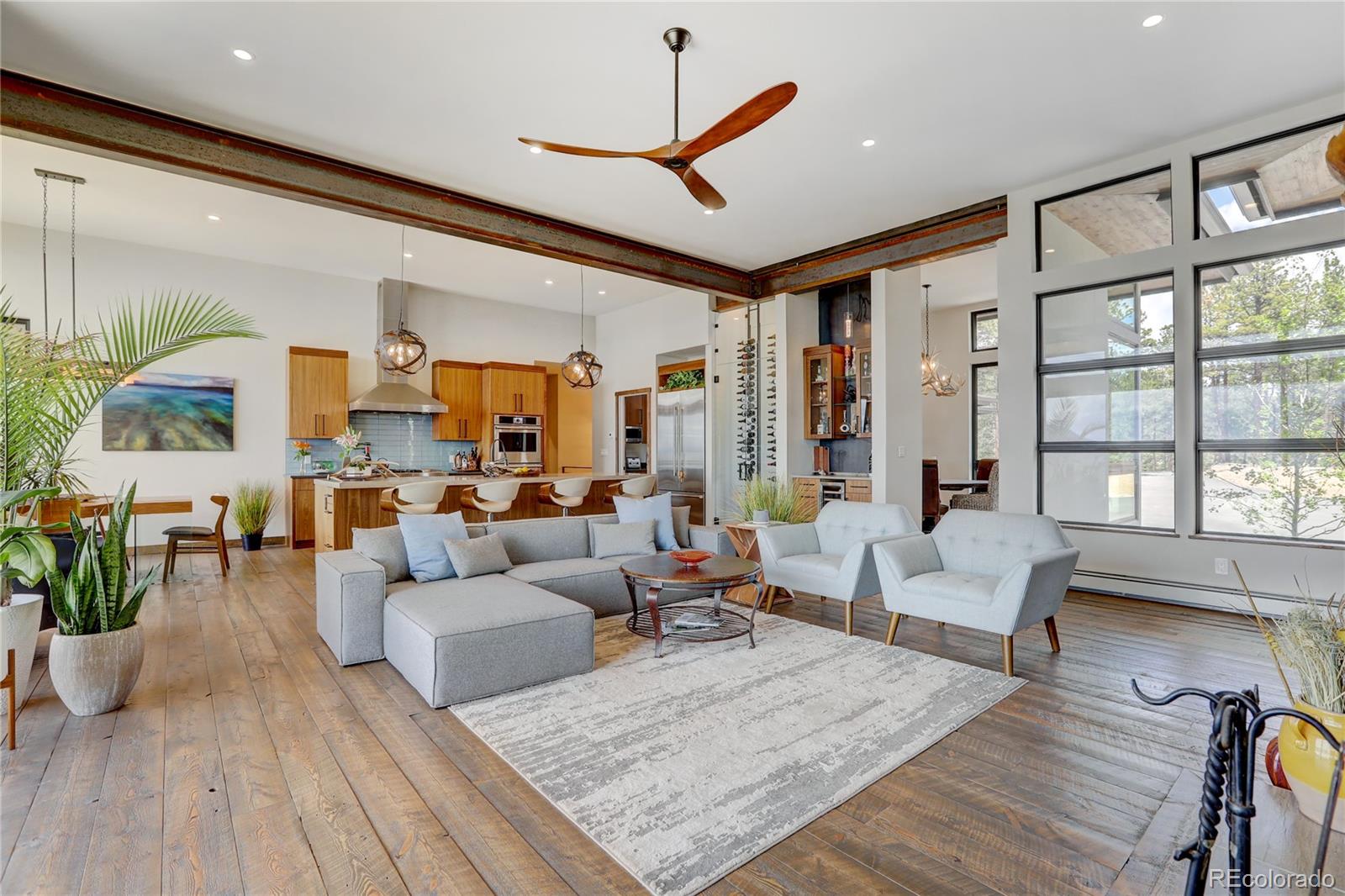 31995 Half Peak Trail Pine, CO 80470 - Photo 6 of 40 a living room with furniture or couch and a large window