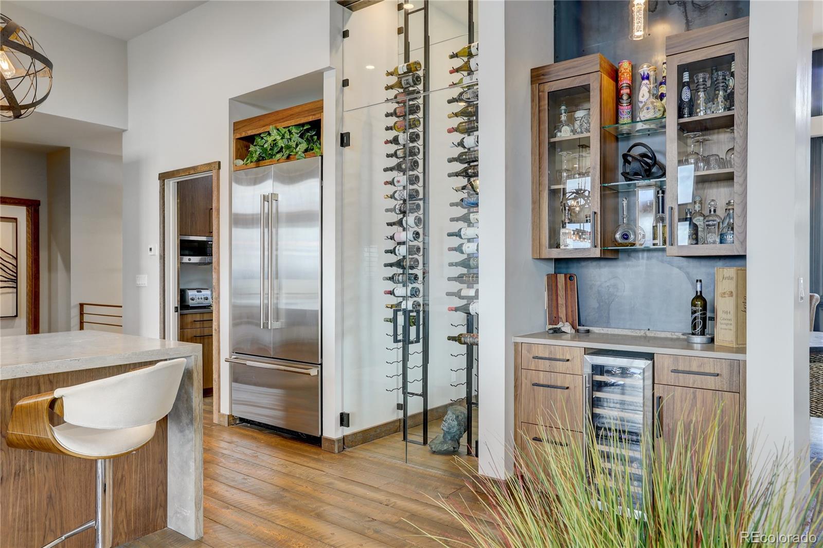 31995 Half Peak Trail Pine, CO 80470 - Photo 9 of 40 a kitchen with stainless steel appliances granite countertop a refrigerator and a stove