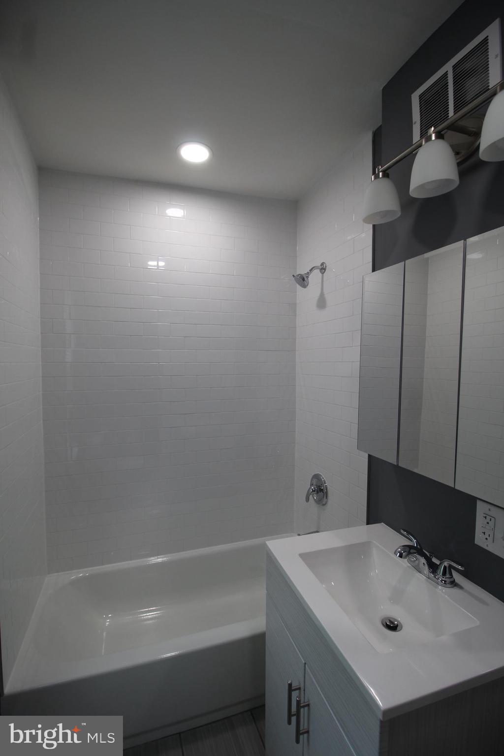 3086 Memphis Street Philadelphia, PA 19134 - Photo 7 of 18 a bathroom with a sink and a bathtub