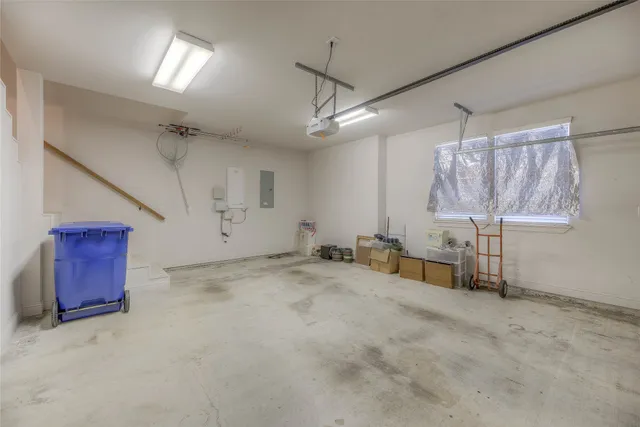 a view of a house with a yard and garage