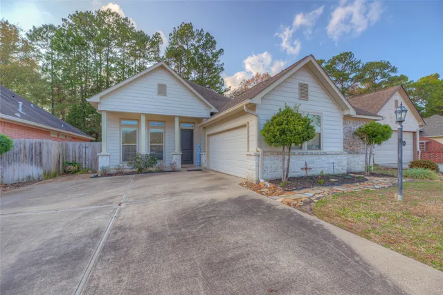 a backyard of a house with trees and outdoor space