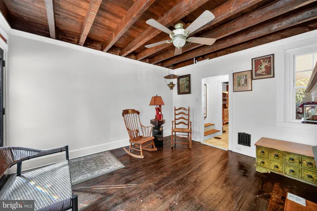 a view of a room with wooden floor