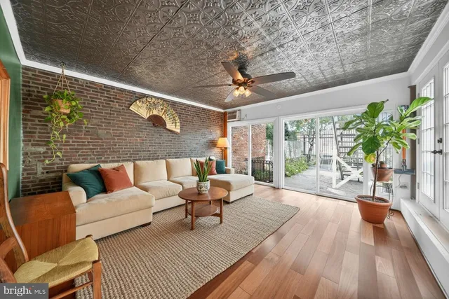 a spacious bedroom with a bed and a chair