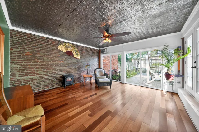 a spacious bedroom with a large bed and a large window