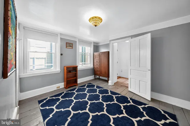 a bathroom with a granite countertop sink mirror bathtub and a shower