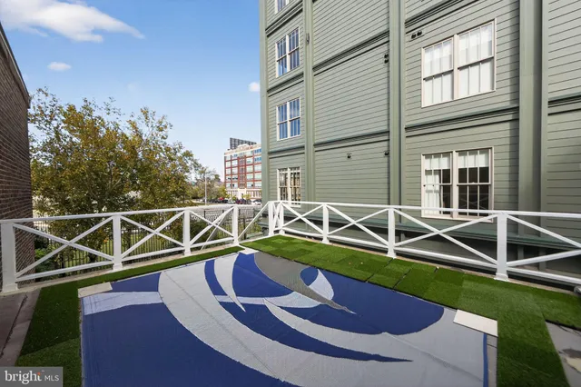 a room with a fireplace and a potted plant