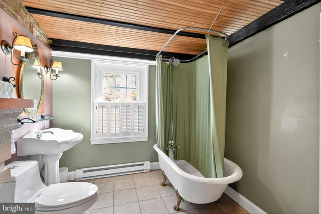 a view of a patio with couches and potted plants