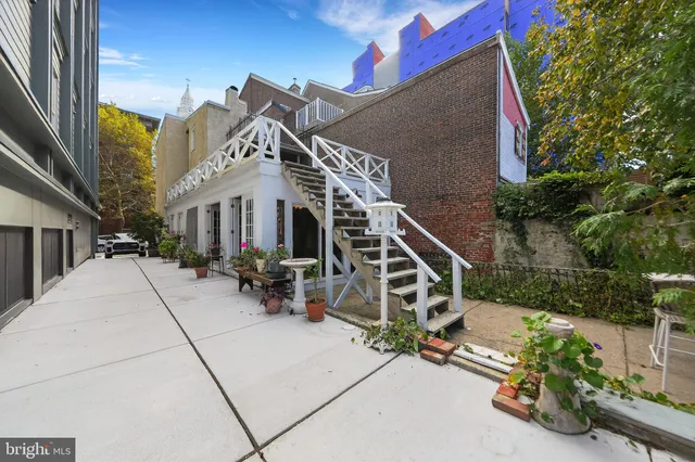 a view of a white building with many windows