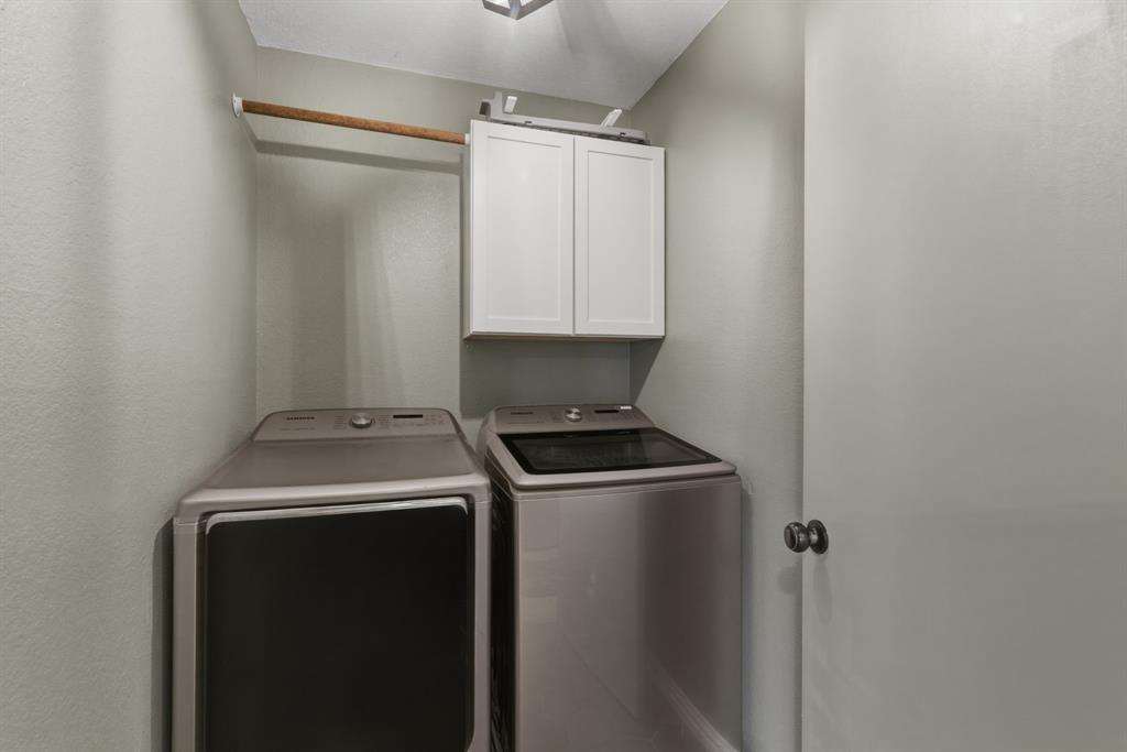945 Lakeridge Drive Azle, TX 76020 - Photo 27 of 40 a utility room with dryer and washer