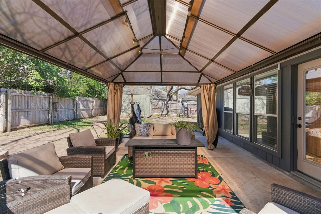 945 Lakeridge Drive Azle, TX 76020 - Photo 31 of 40 a outdoor space with patio lots of furniture and garden