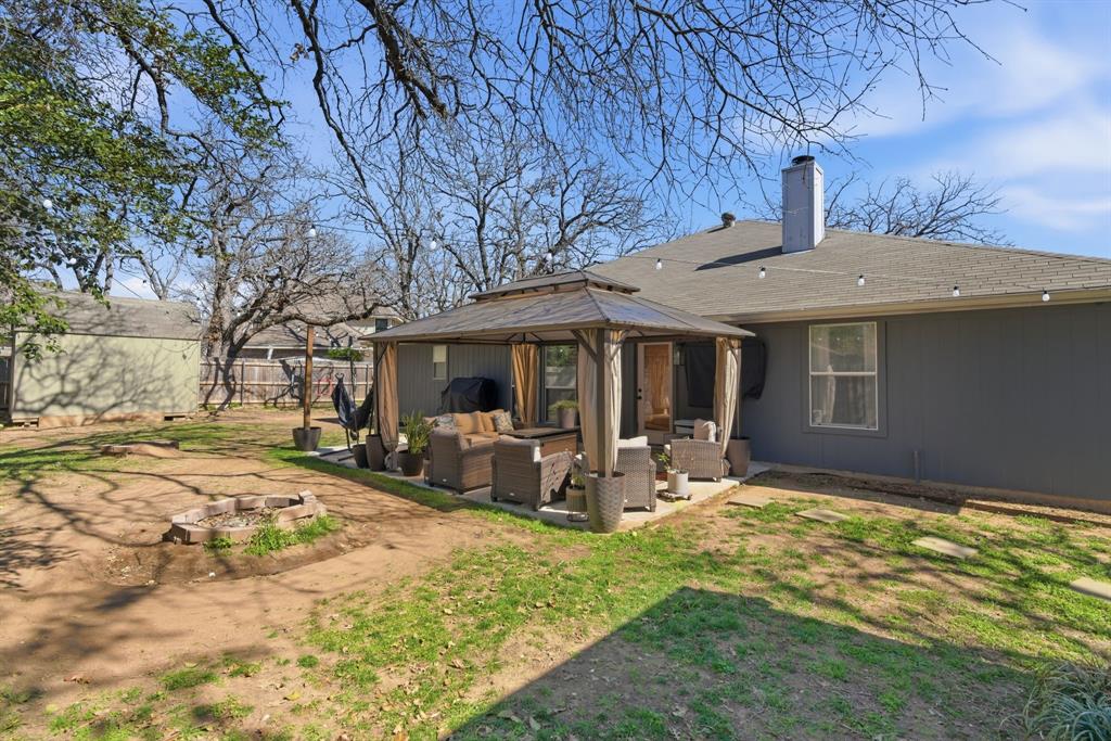 945 Lakeridge Drive Azle, TX 76020 - Photo 32 of 40 a view of a house with backyard