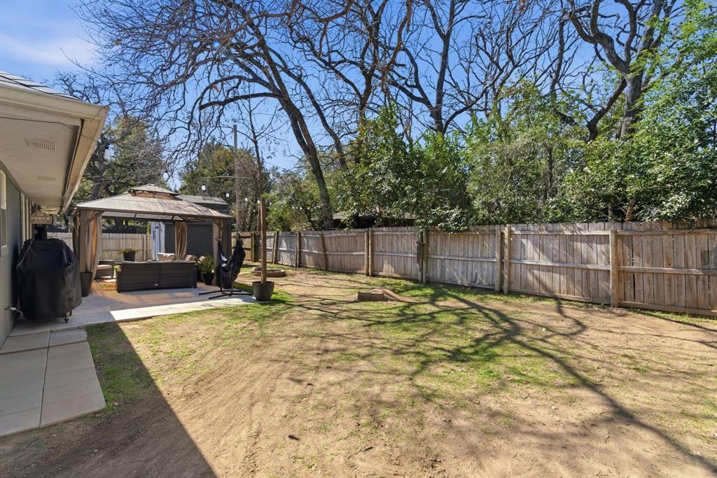 945 Lakeridge Drive Azle, TX 76020 - Photo 35 of 40 a view of a house with backyard and sitting area
