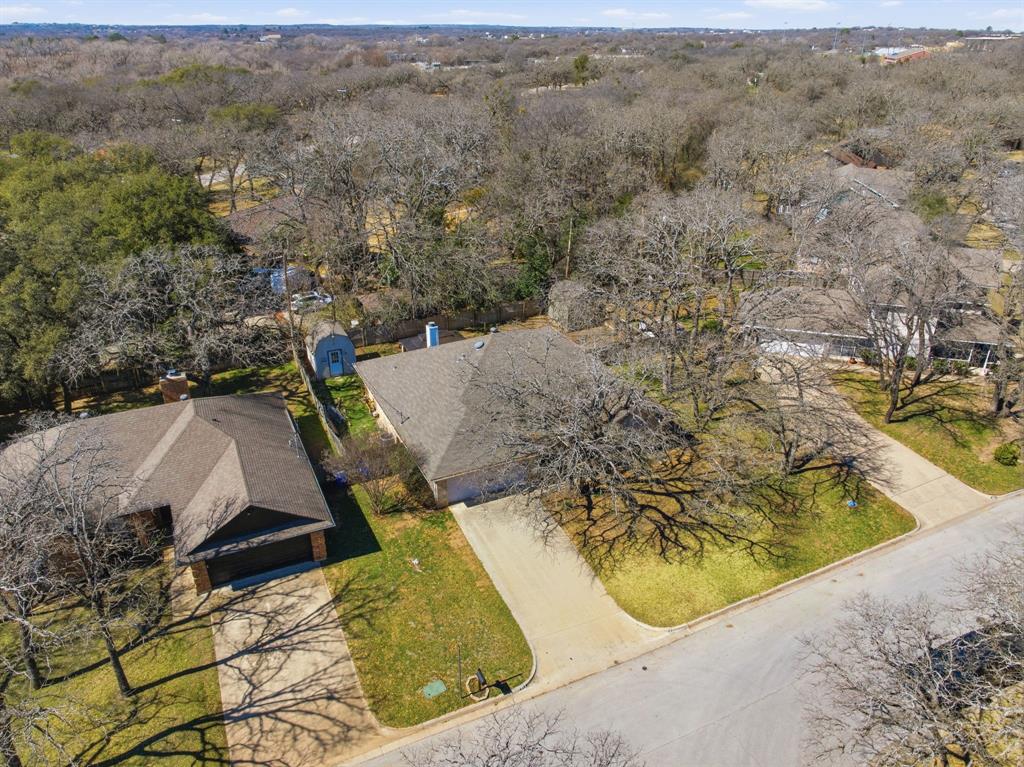 945 Lakeridge Drive Azle, TX 76020 - Photo 38 of 40 a view of a swimming pool with a yard
