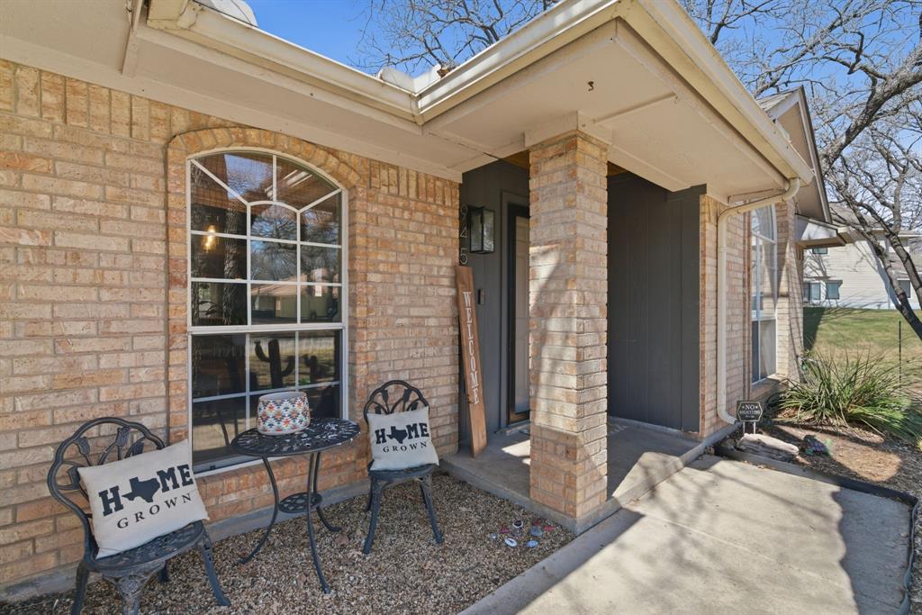 945 Lakeridge Drive Azle, TX 76020 - Photo 5 of 40 a front view of a house with outdoor seating