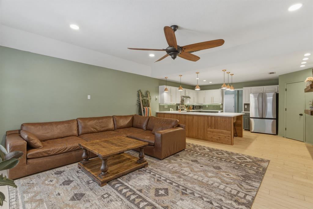 945 Lakeridge Drive Azle, TX 76020 - Photo 10 of 40 a living room with furniture and kitchen view