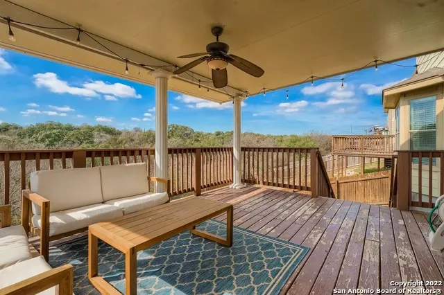 a view of balcony with wooden floor and outdoor seating