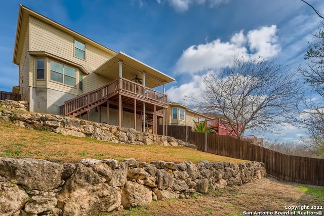 10714 Ranchland Fox San Antonio, TX 78245 - Photo 22 of 24 a view of a house with a yard