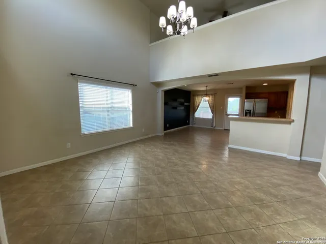 a view of a hallway with a chandelier