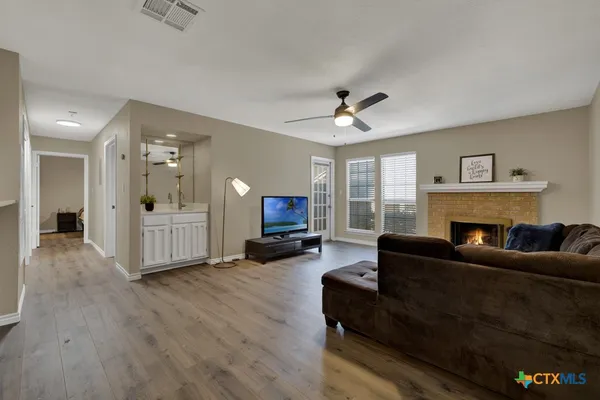 a living room with furniture and a fireplace
