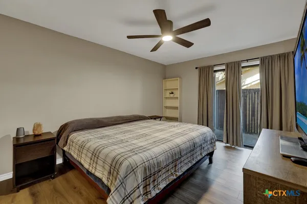a bedroom with bed and window