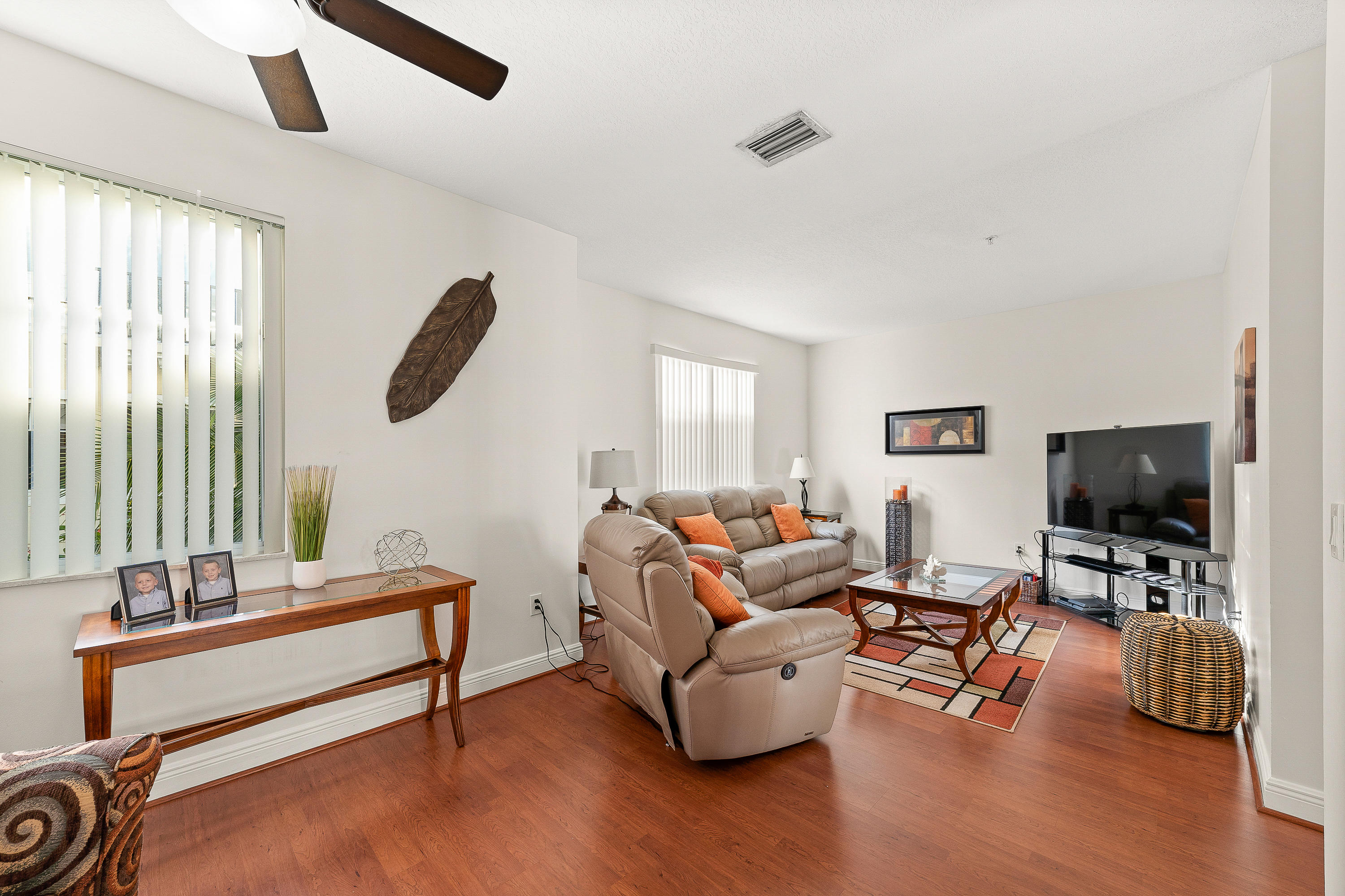 613 Northwest 38th Circle Boca Raton, FL 33431 - Photo 11 of 31 a living room with furniture and a flat screen tv