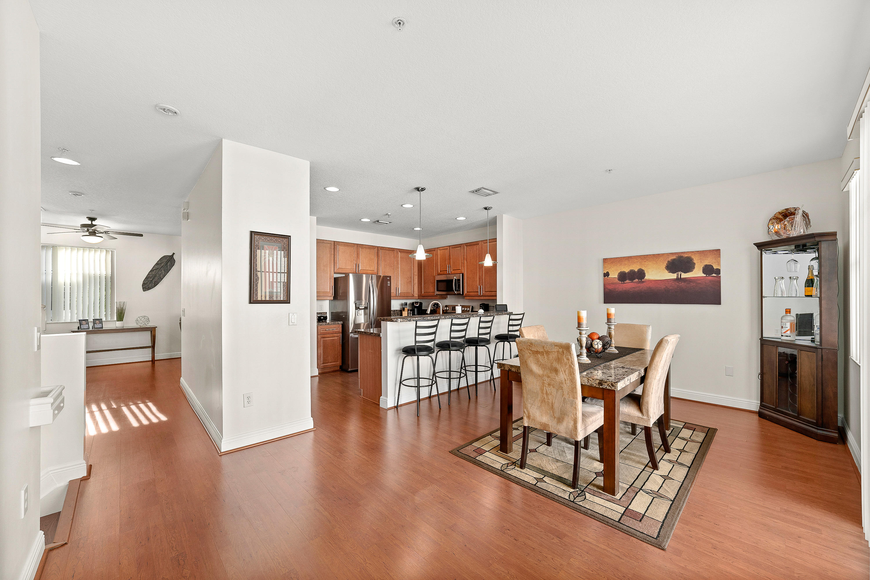 613 Northwest 38th Circle Boca Raton, FL 33431 - Photo 15 of 31 a view of a dining room with furniture and wooden floor