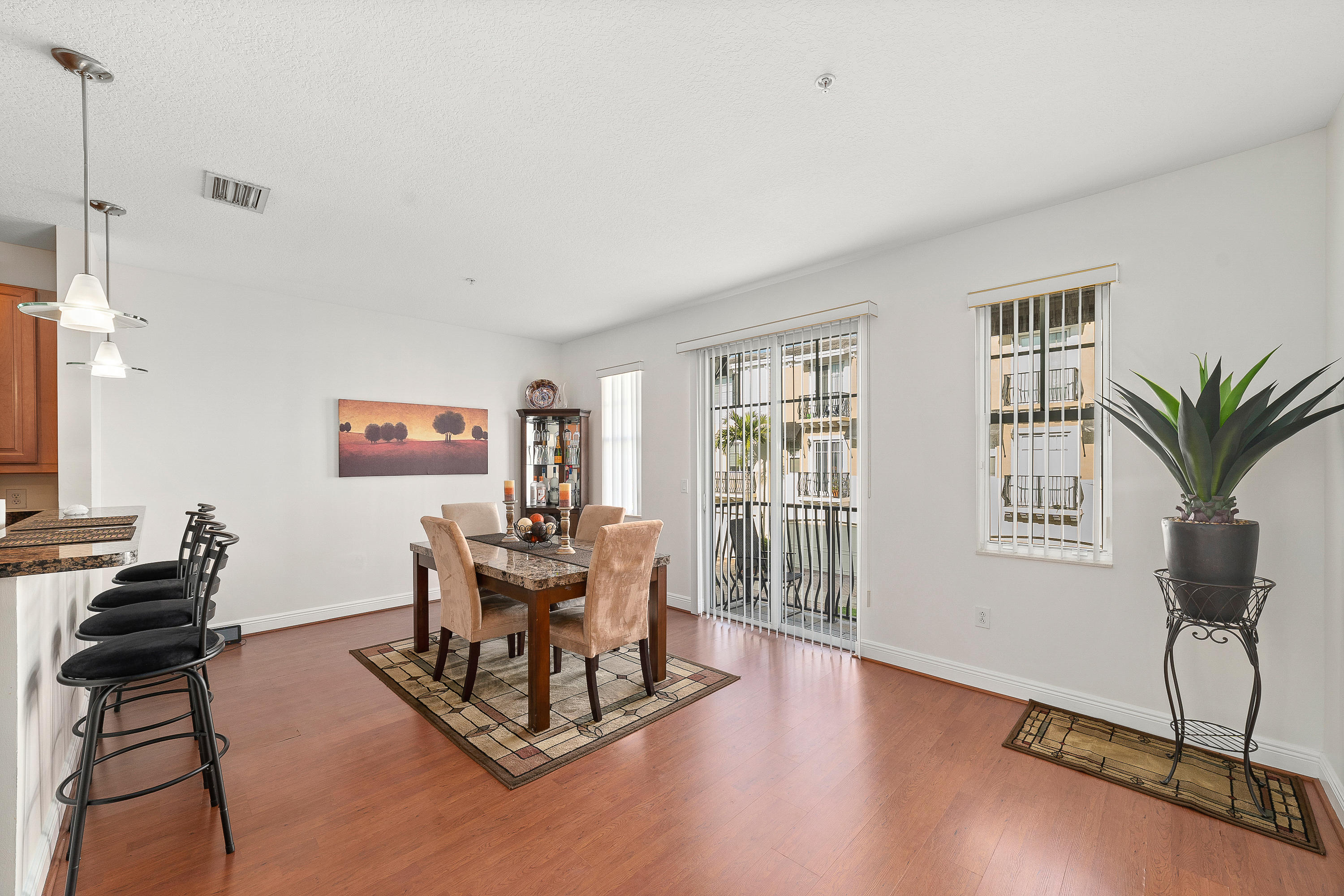613 Northwest 38th Circle Boca Raton, FL 33431 - Photo 18 of 31 a living room with furniture a window and a potted plant