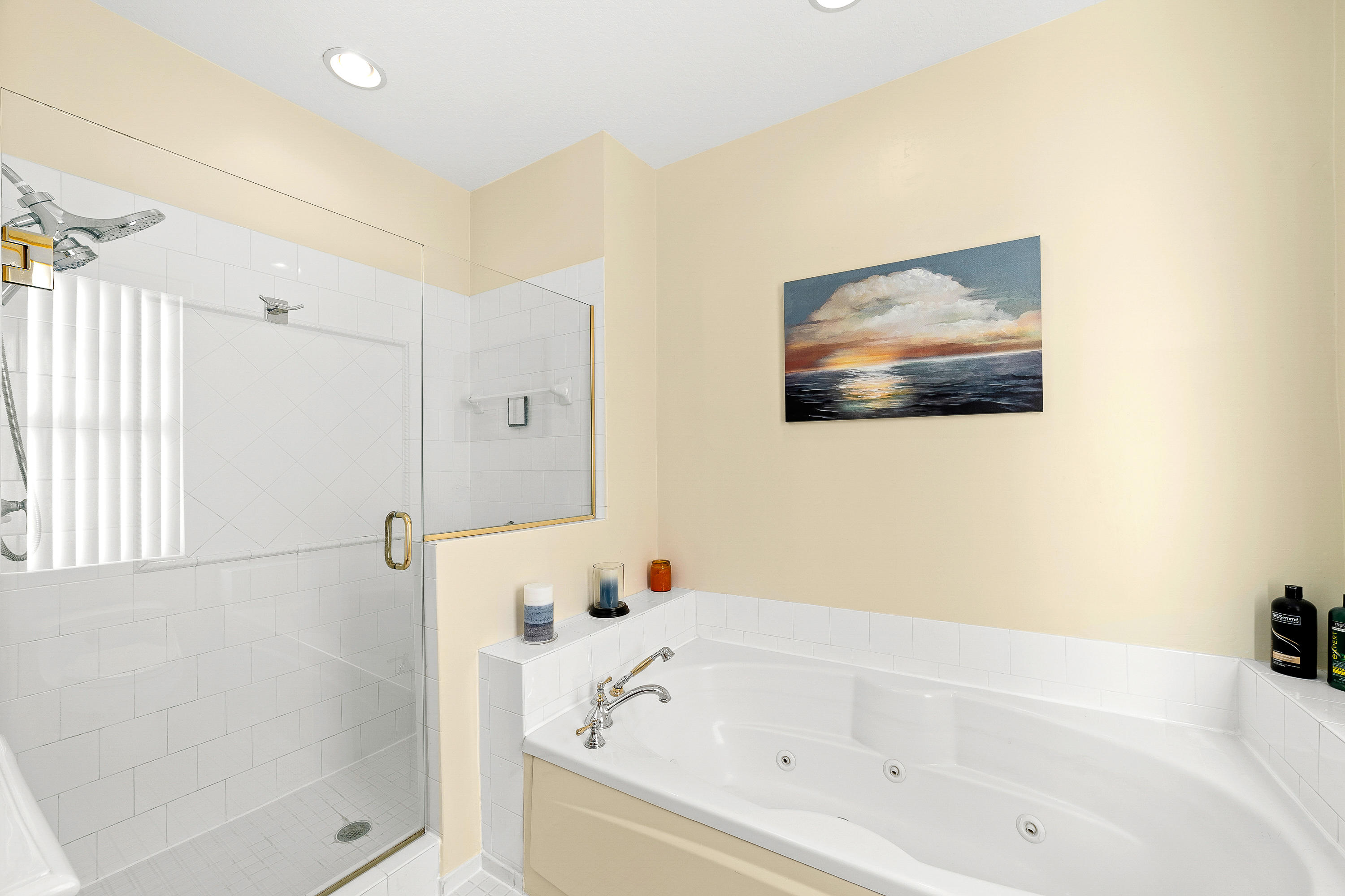 613 Northwest 38th Circle Boca Raton, FL 33431 - Photo 24 of 31 a bathroom with a tub and shower