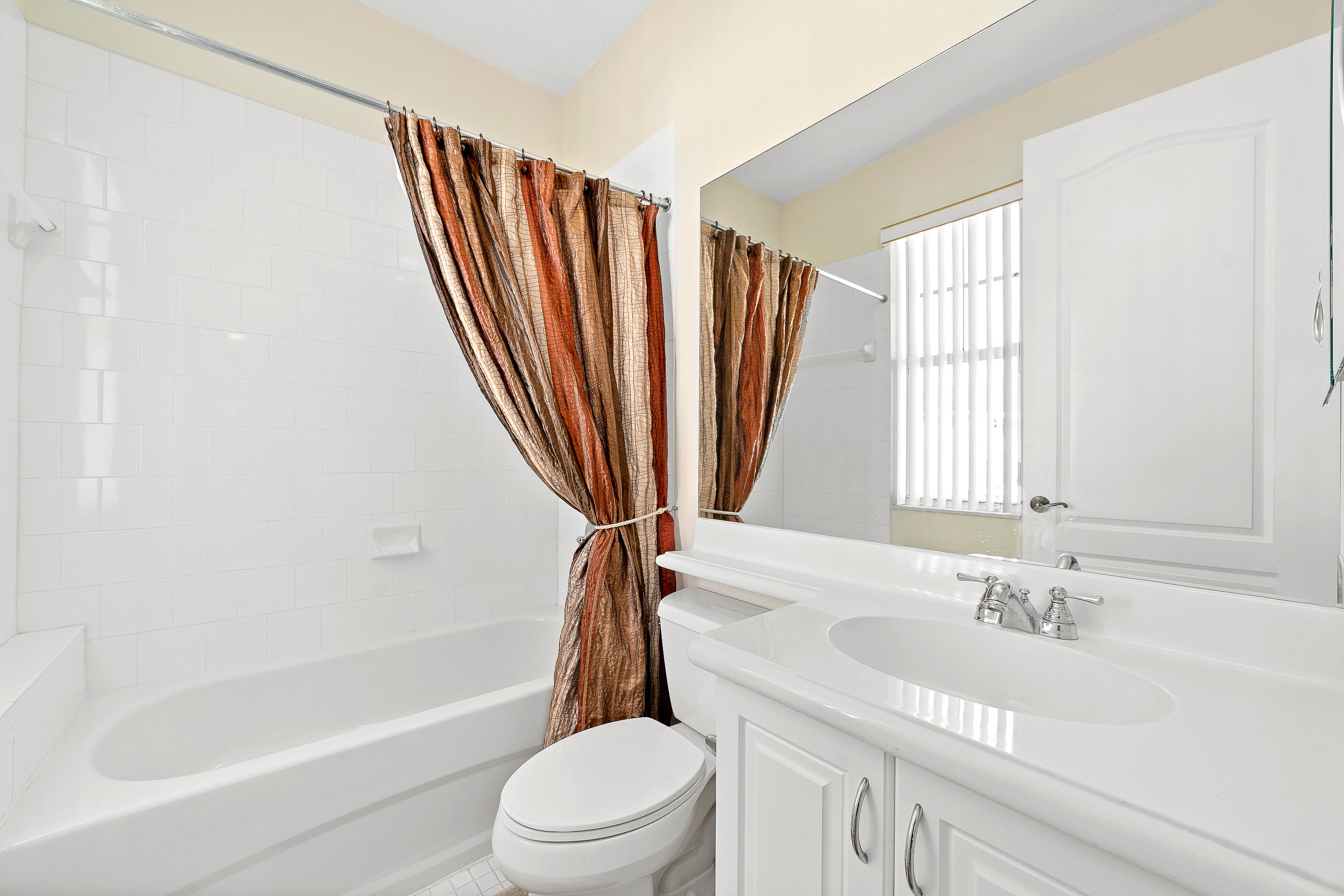 613 Northwest 38th Circle Boca Raton, FL 33431 - Photo 28 of 31 a bathroom with a sink a toilet and a bathtub